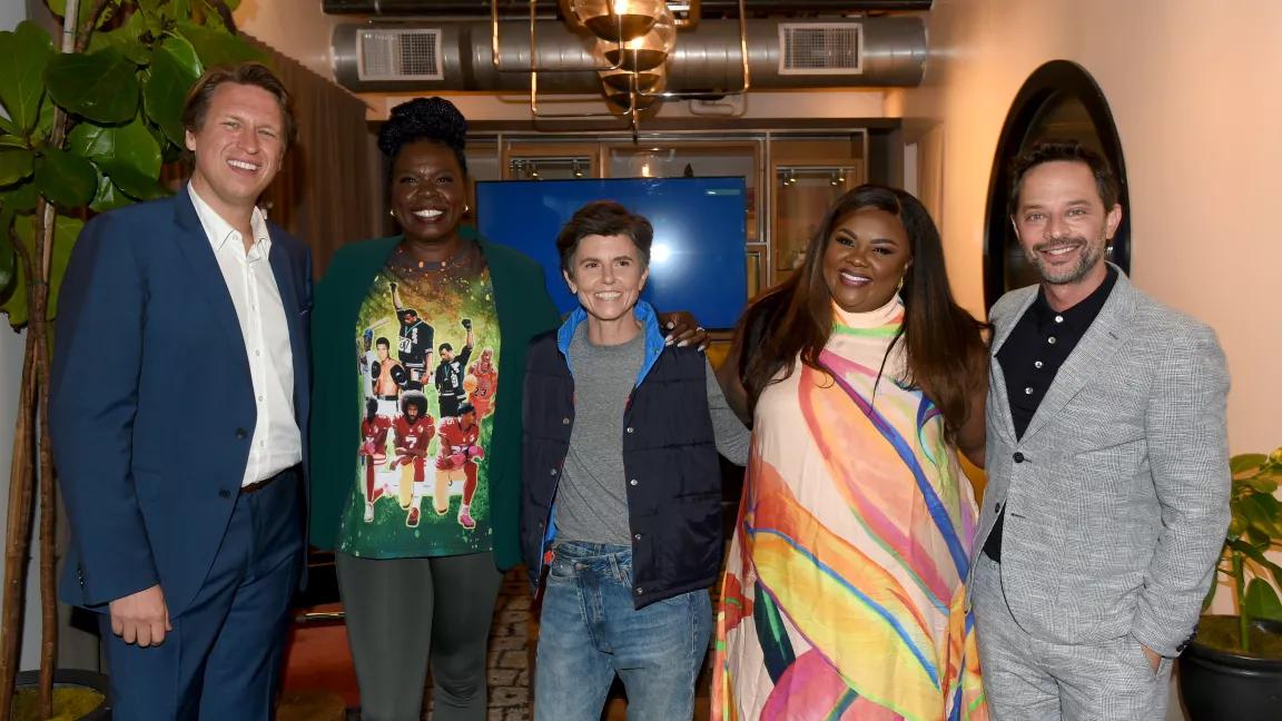 Pete Holmes, Leslie Jones, Tig Notaro, Nicole Byer, and Nick Kroll posing for the camera