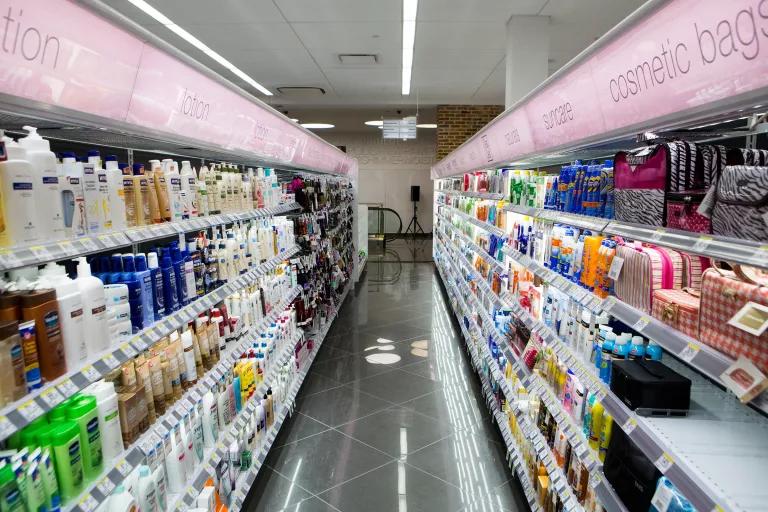 A store aisle filled with cosmetics and lotion bottles