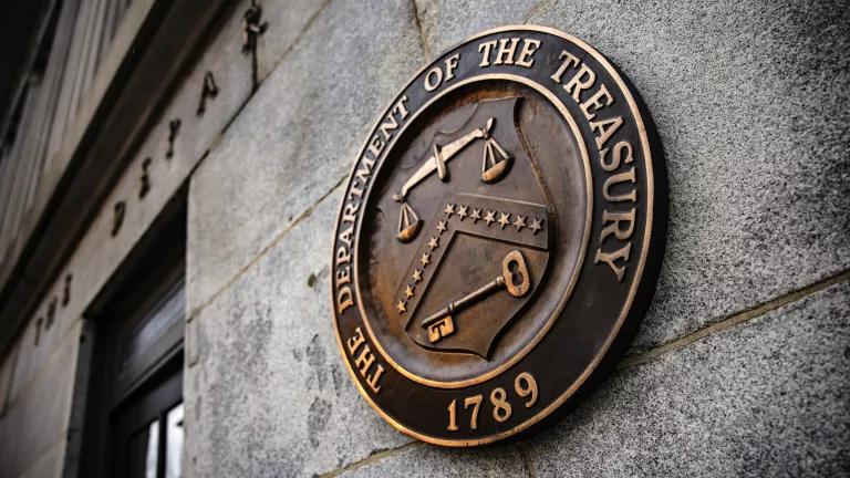 A plaque with the U.S. Treasury Department's seal outside of their offices