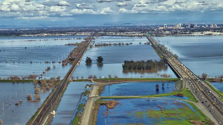 An aerial view of the marshy surroundings of the I-80 Yolo Causeway and Capitol Corridor tracks
