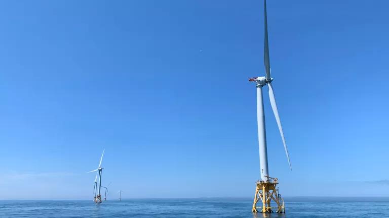 wind turbines on blue waters