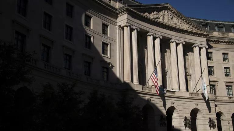 A dark shadow falls over half of the exterior of the U.S. Environmental Protection Agency Headquarters building on a sunny day