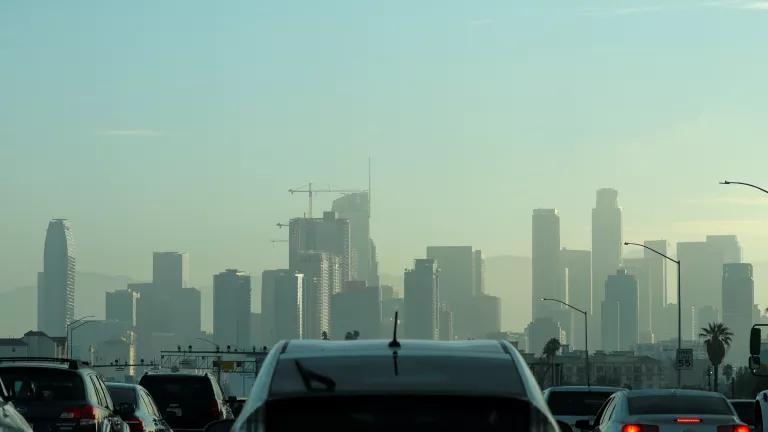 A traffic jam with a hazy skyline in the background