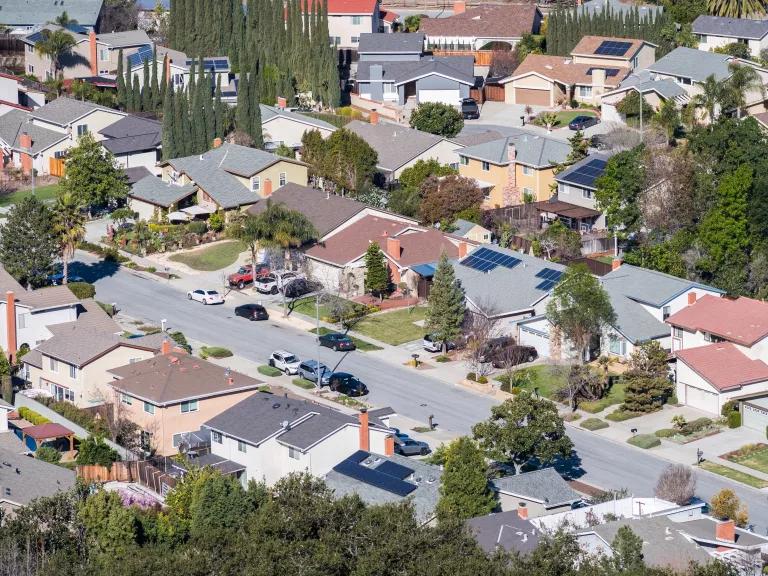 An aerial view of rooftop solar panels on homes in San Jose, California.
