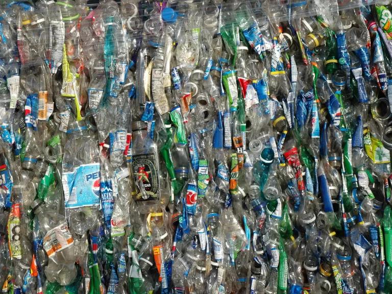 A bundle of flattened plastic bottles and waste