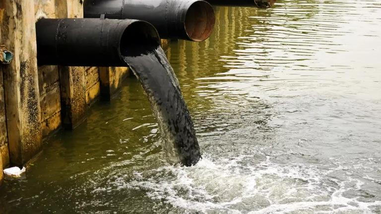 Effluent pours out of a large pipe