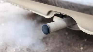 Close up of emissions from the tailpipe of a car.